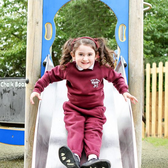 girl coming down a slide