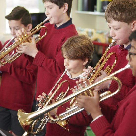 children playing trumpets